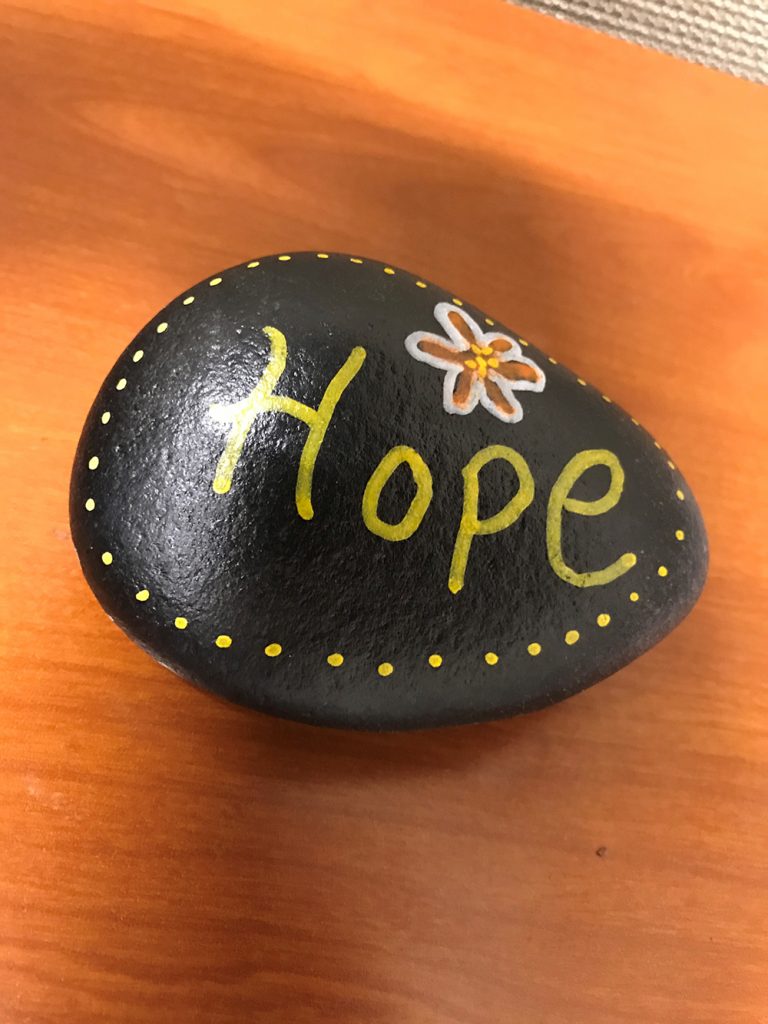 Photo of hand-painted stone found by his Dad