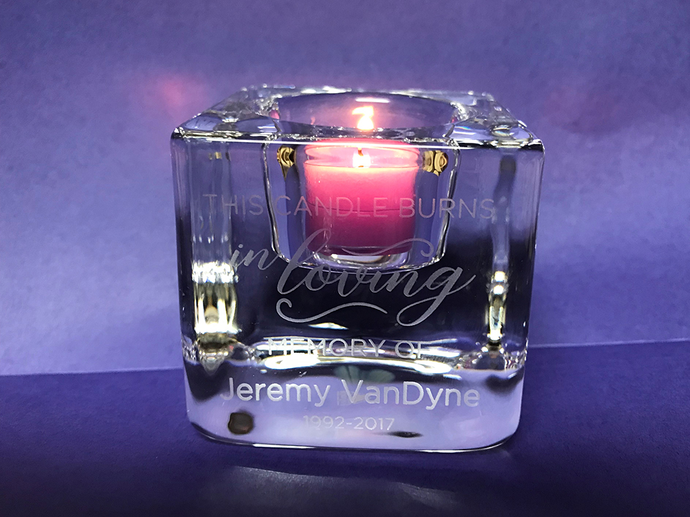 Photo of memorial glass votive candle with etched inscription