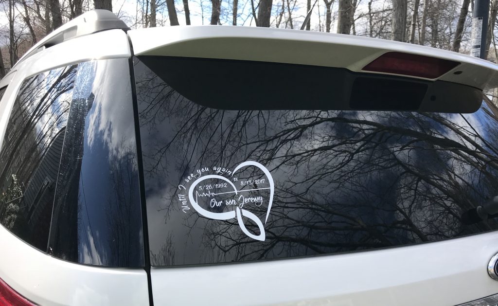 Photo of memorial decal applied to the rear window of the family car