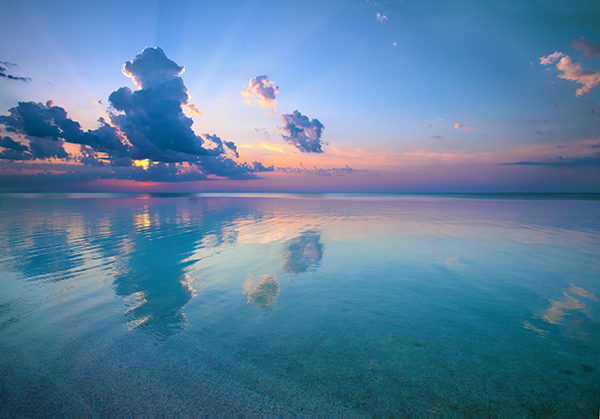 Photo of Sunrise over blue sea
